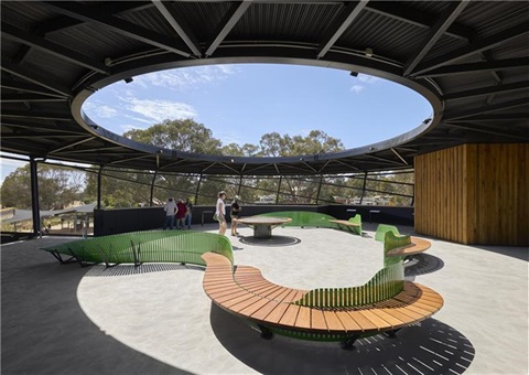 Open-air viewing platform at Ned Kelly Discovery Hub in Glenrowan with circular seating and large skylight.